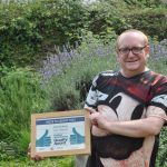 Growing Works Volunteer holds certificate at Almondbury Allotment