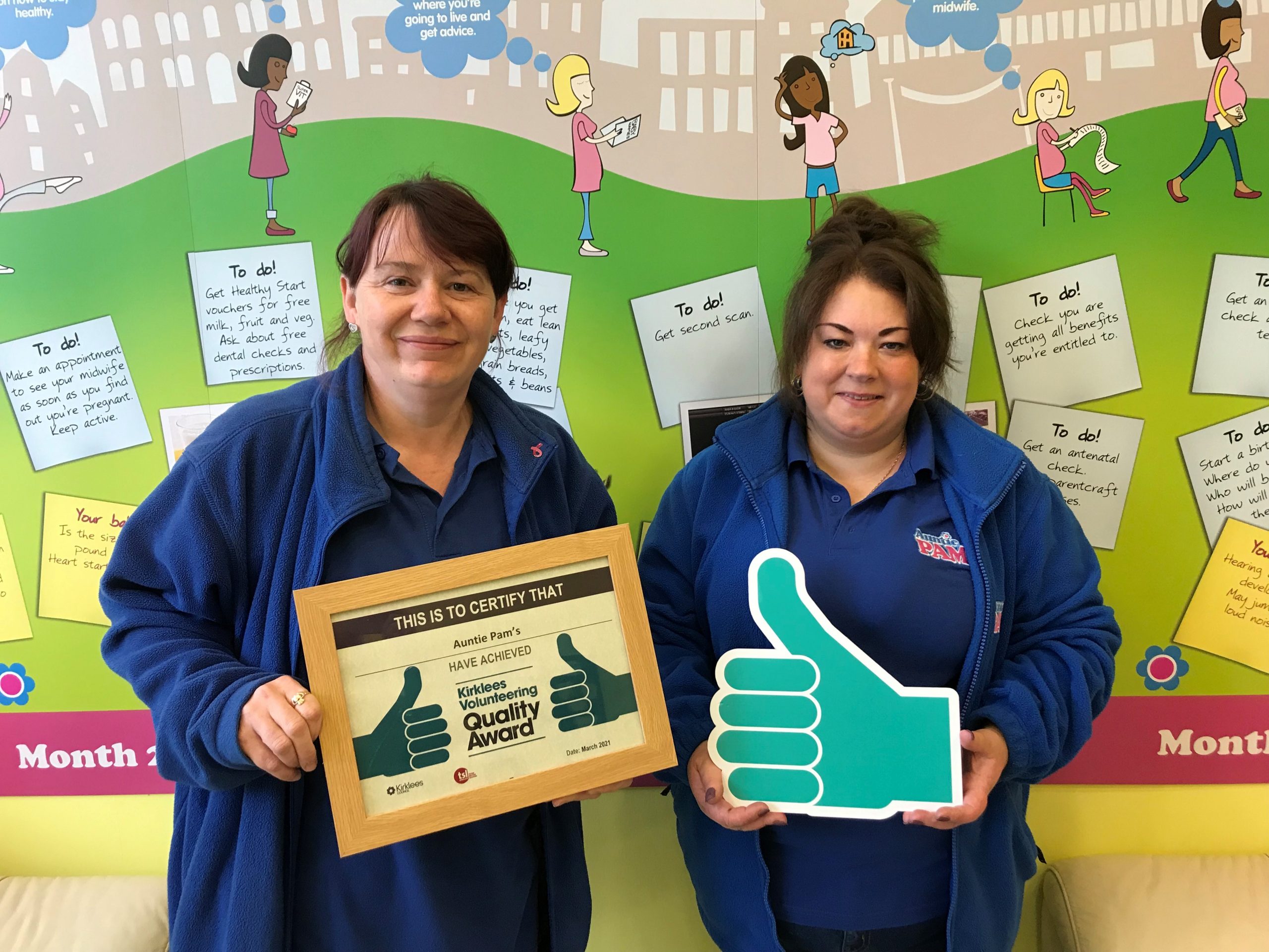 staff holding certificate and thumbs up icon.