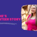 Volunteer in pink dress smiling