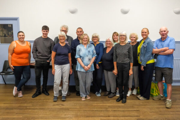 Group photo of Slaithwaite Meals on Wheels volunteers with Kim in centre.